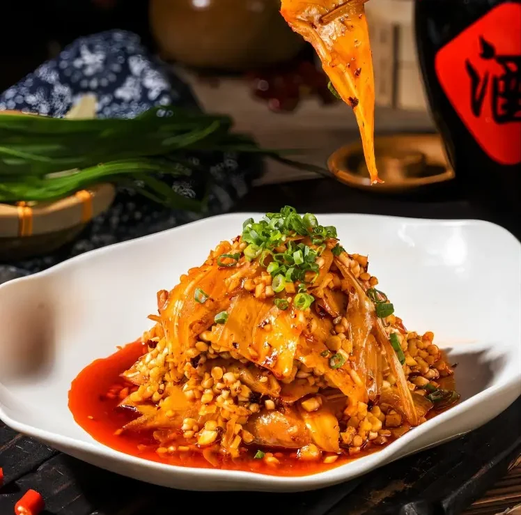 Close-up of Chengdu hot sliced pork in red chili oil, a classic dish at local night markets