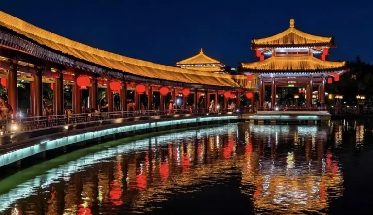 Night view of The Datang Furong Garden in Xi’an, featuring illuminated pavilions and reflections on the lake