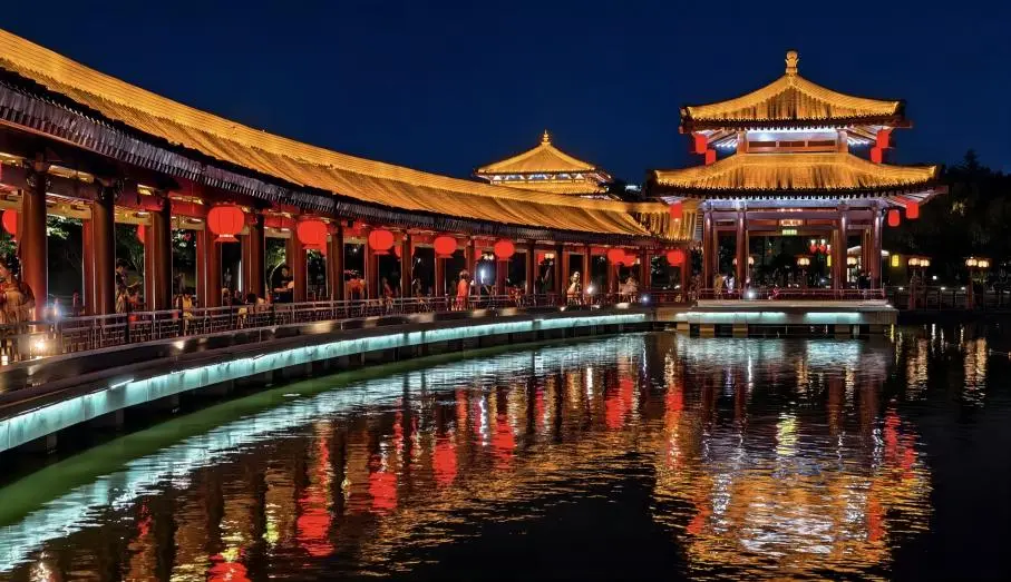 Night view of The Datang Furong Garden in Xi’an, featuring illuminated pavilions and reflections on the lake