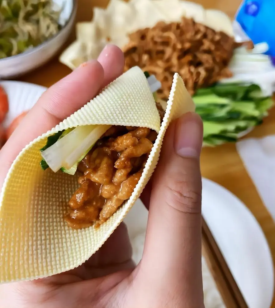 Jingjiang Rousi (Shredded Pork in Sweet Bean Sauce) on Beijing Local Food Trails, served with thin tofu wrappers and vegetables