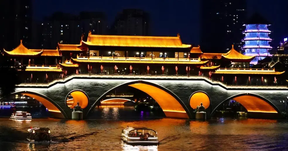 Jiuyanqiao Night Market in Chengdu, part of the Chengdu Night Markets, bustling with vibrant street food stalls, riverside views, and lively nightlife