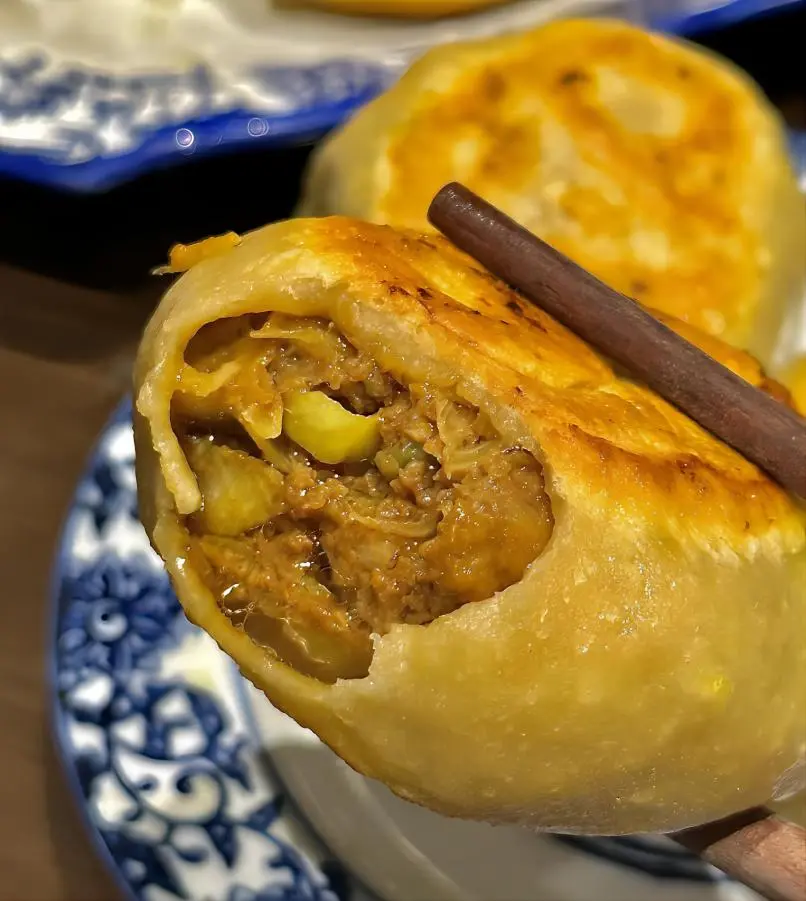 Mending Roubing (Door Nail Meat Pie), traditional Beijing meat pie with crispy crust and juicy beef filling