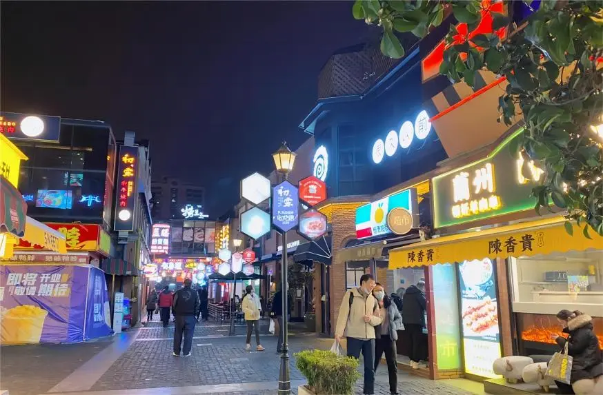 Changli Road night market in Shanghai with food stalls and crowds