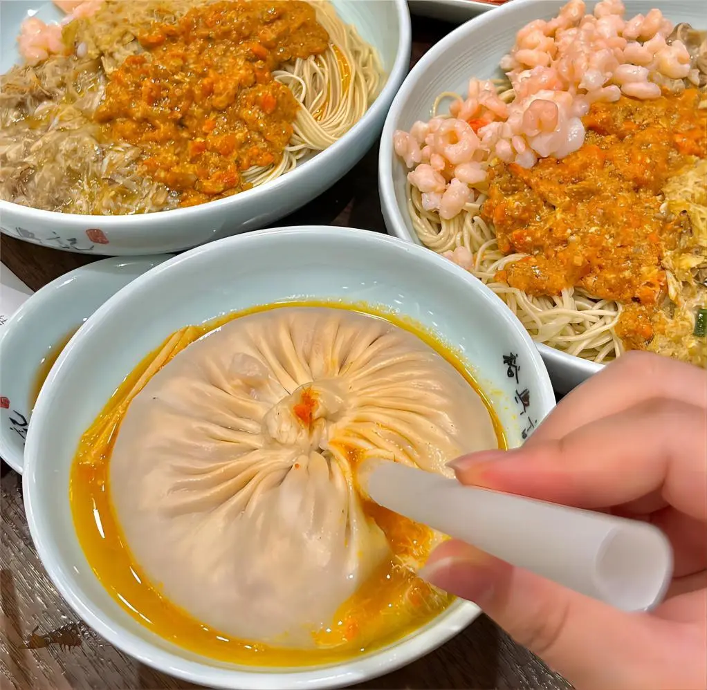 Crab Roe Xiaolongbao, a signature [Shanghai local food] delicacy with savory soup bursting inside