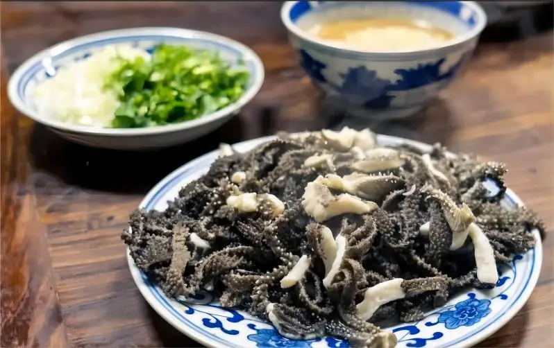 Close-up of Baodu, Beijing’s classic quick-boiled tripe dish served with sesame paste dipping sauce.