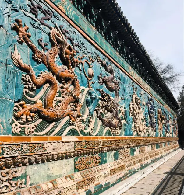 Double-sided Nine-Dragon Wall at Beihai Park, Beijing, showcasing intricate imperial craftsmanship and vibrant colors.