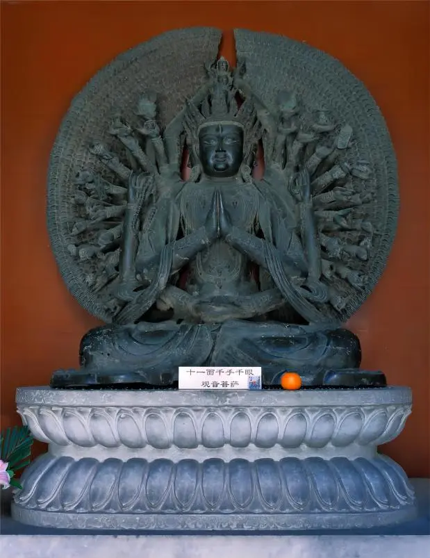 Statue of Guanyin inside Beijing Baitasi Temple, representing compassion and mercy.