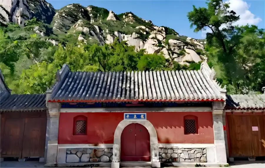 Entrance gate of Beijing Longquan Temple showcasing traditional Chinese architectural style.