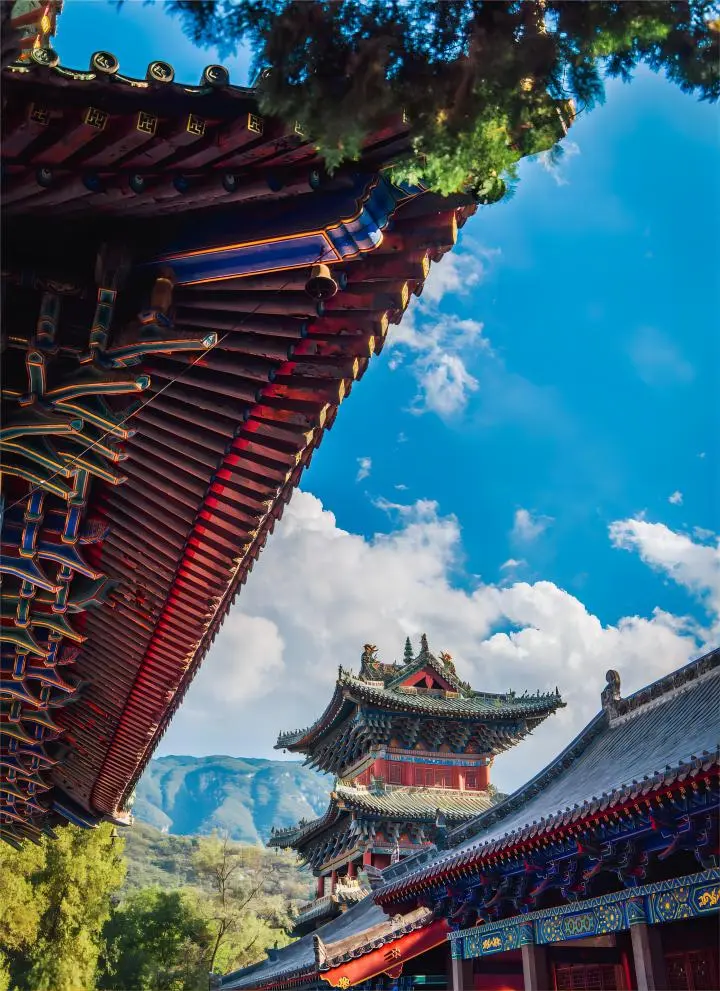 Sunlit close-up of a Chinese temple building, highlighting traditional architecture and serene atmosphere, a striking example of temples in China.