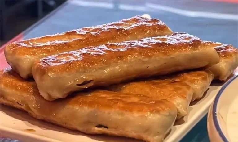 Handcrafted Dalian Huoshao from Beijing, showing flaky crust and juicy filling