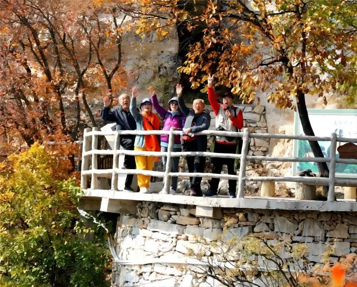 Elderly people climbing a hill during the Chongyang Festival, celebrating the tradition along with enjoying Chongyang Festival foods.