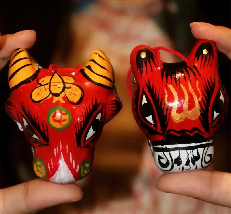 Fengxiang Clay Sculpture Twelve Zodiac set on a refrigerator surface, showcasing Xi’an intangible cultural heritage.