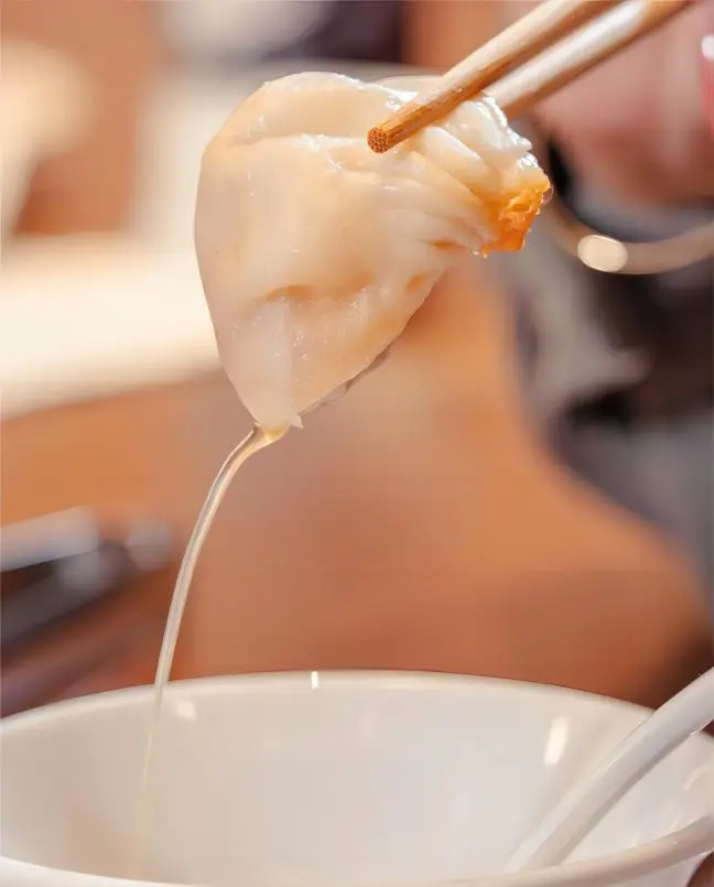 Close-up of juicy Nanxiang Xiaolongbao, a classic Shanghai Xiaolongbao delicacy
