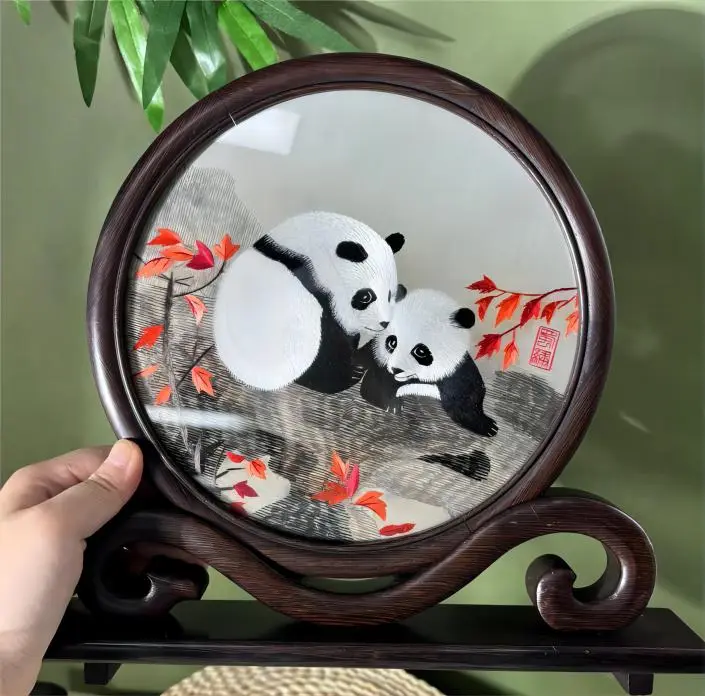 Back side of double-sided Shu Embroidery (Shuxiu) showing playful panda design