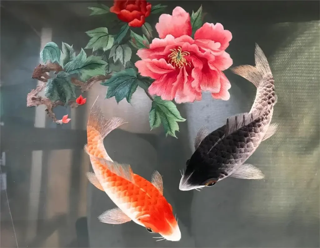 Reverse side of Shu Embroidery (Shuxiu) showing detailed koi fish and hibiscus motifs