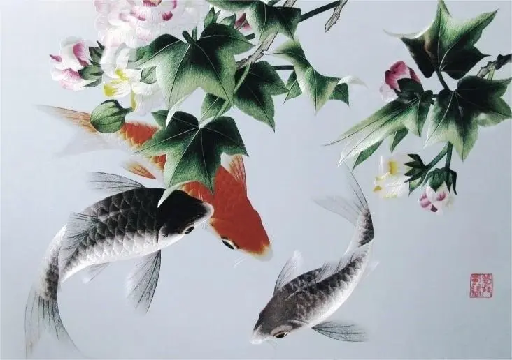 Close-up of Shu Embroidery (Shuxiu) featuring koi fish and hibiscus details