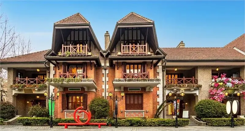 Century-old garden villa at Sinan Mansions Shanghai, showcasing Neo-Classical and Art Deco details.