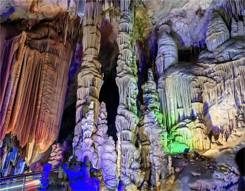 The Twin Pillars of Love in Stone Flower Cave, two towering stalactite columns standing side by side like devoted lovers.