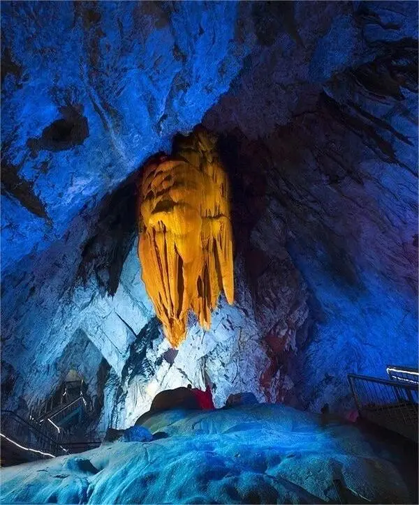 The Silver Flags Fluttering formation in Stone Flower Cave, with bright white stone drapes flowing gracefully like banners in the wind.