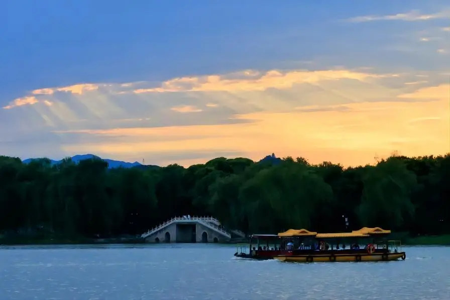 Sunset over Yuanmingyuan (Old Summer Palace), Beijing, highlighting golden autumn light across the historic gardens.