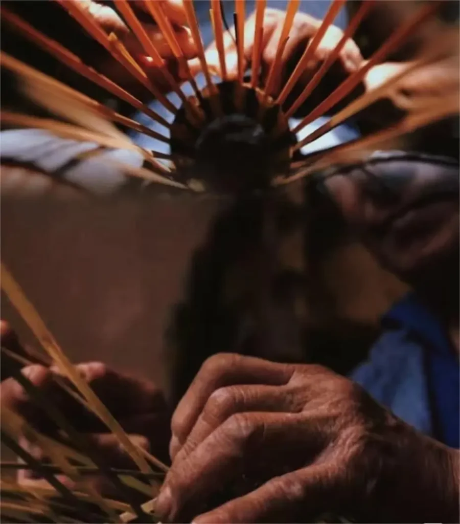Close-up of artisan hand weaving bamboo in Zhouzhuang water town, Jiangnan traditional craft