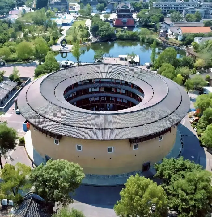 This aerial image showcases the panoramic view of Bokelou, a landmark building in Luodai Ancient Town, highlighting its unique position and overall charm within the town.