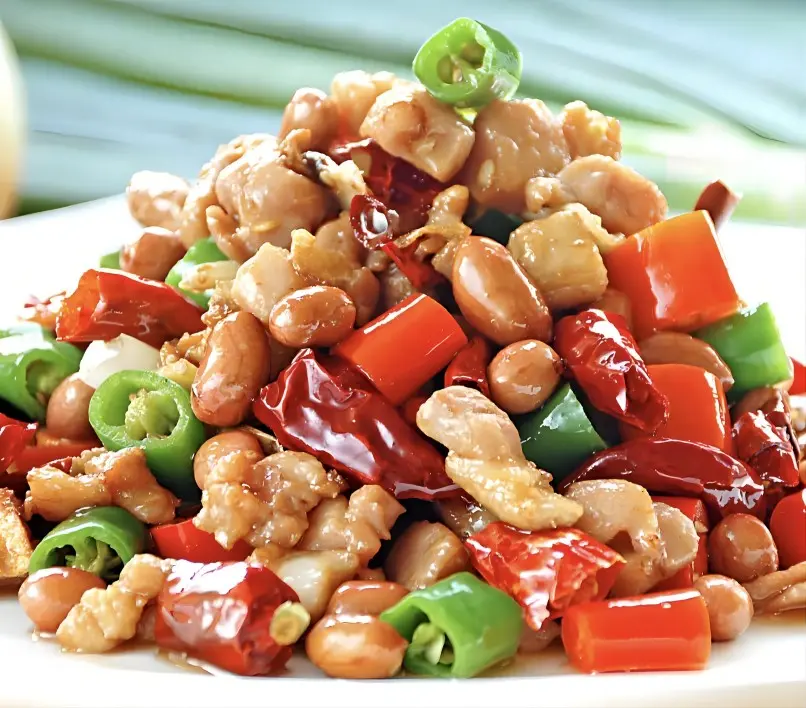 Close-up of authentic Chengdu Kung Pao Chicken with peanuts and chili peppers