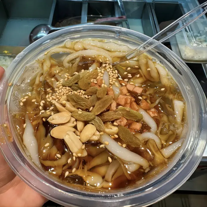 Liangxia cold rice drops with toppings, handmade local snack in Chengdu