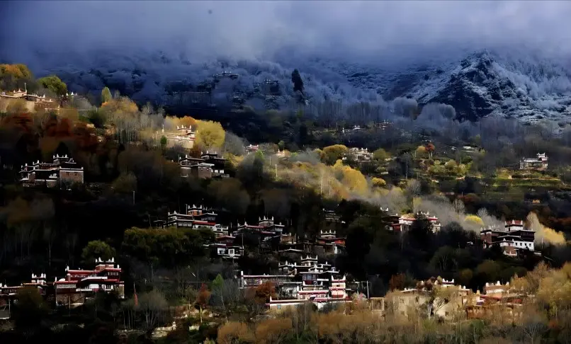 Evening view of Danba Tibetan Village with ancient watchtowers and fading sunlight