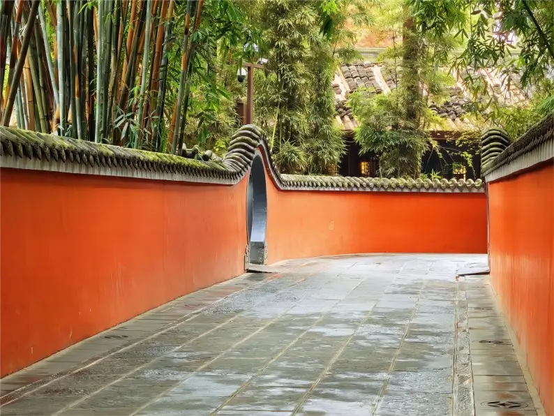 The iconic red wall path at Du Fu Thatched Cottage, a popular scenic spot in Chengdu.