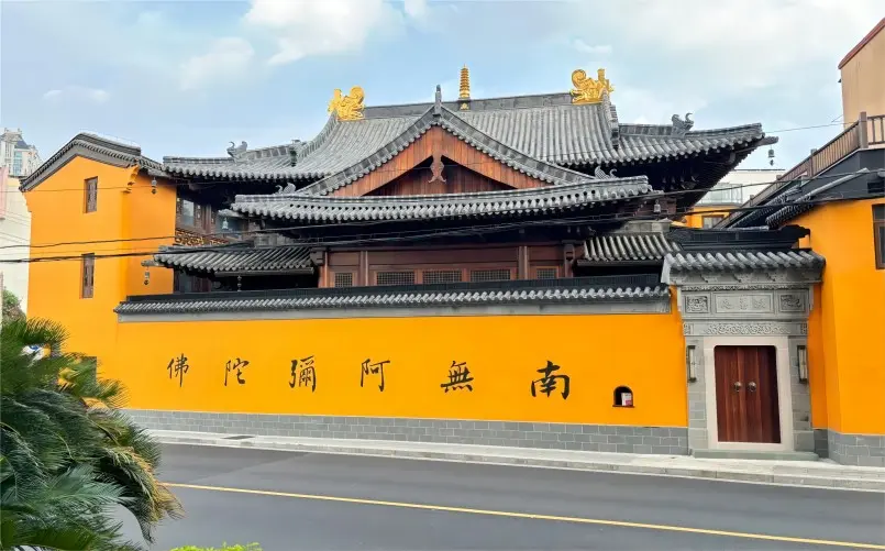 Exterior panorama of Fashan Nunnery in Shanghai, showing traditional white walls, dark eaves, and tranquil courtyards.