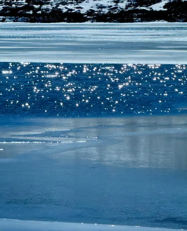 Close-up of clear blue water at Red Sea Lake Hong Haizi reflecting light and sky
