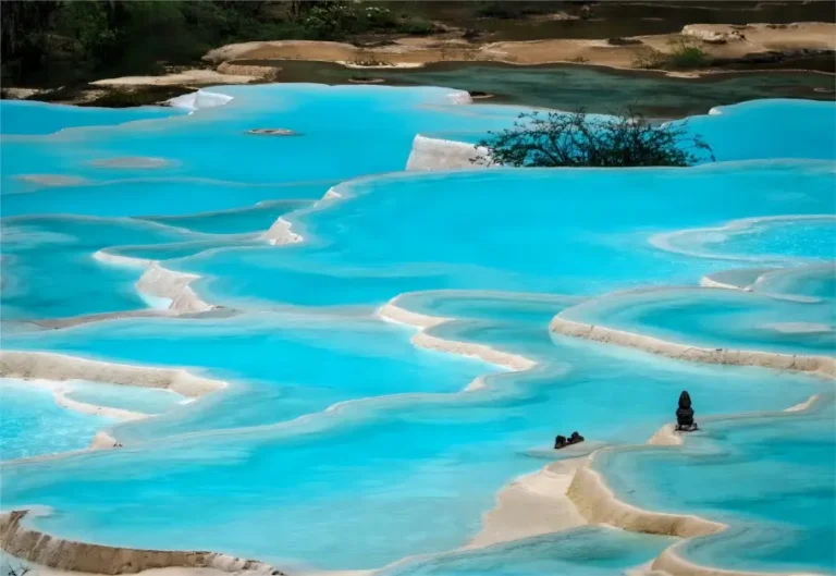 Close-up of colorful travertine pools at Five-Color Ponds, Huanglong Scenic Area