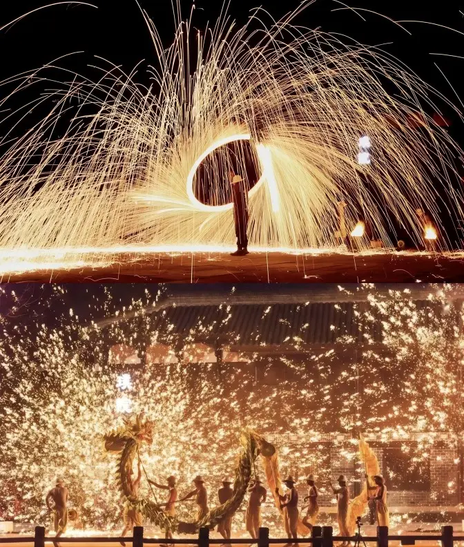 Dragon dance and traditional firework performance during a festival in Huanglongxi Ancient Town