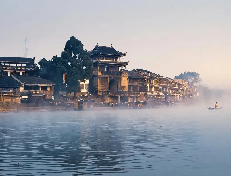 Misty river view at the three rivers junction in Huanglongxi Ancient Town, capturing its poetic water town atmosphere