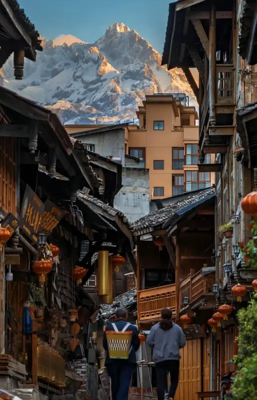 Stone-paved old street in Moxi Ancient Town, showing traditional houses and daily life in western Sichuan