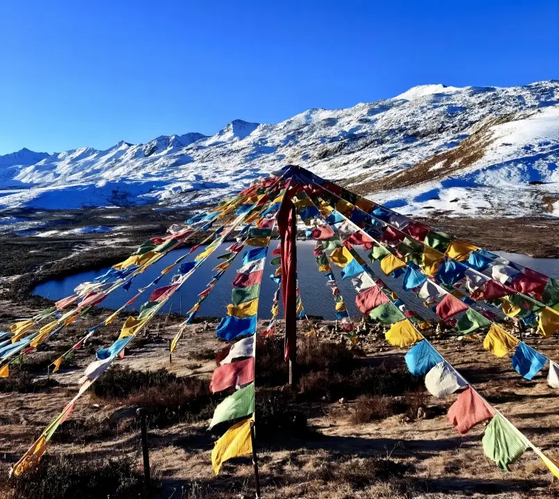 Tibetan prayer flags blowing in the wind by Red Sea Lake Hong Haizi
