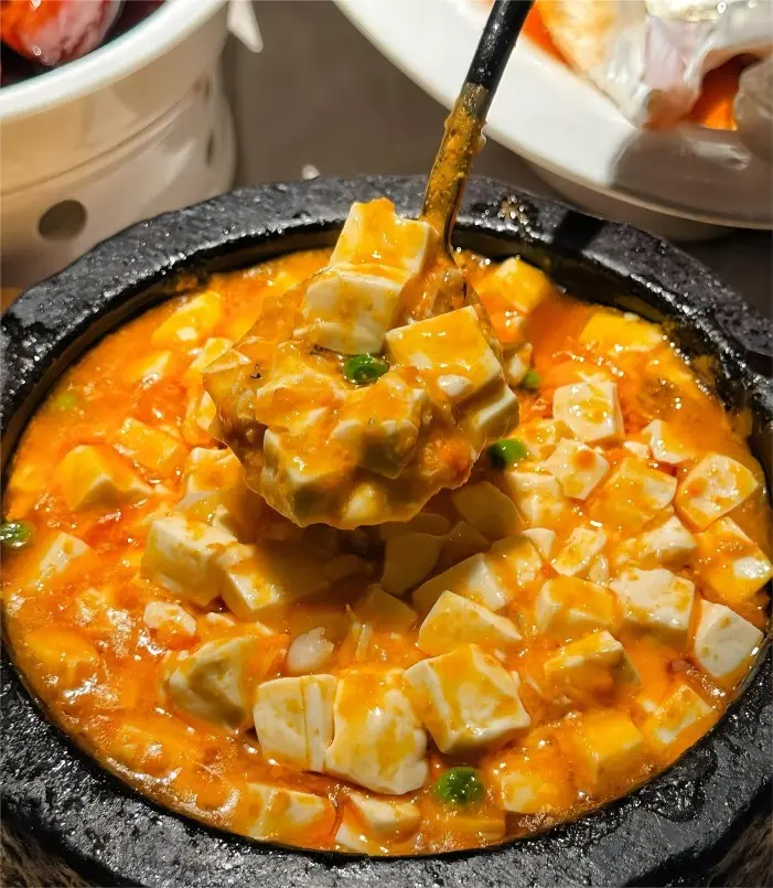 Shanghai Crab Roe Tofu served in a traditional Benbang style, with soft tofu and fresh crab roe.
