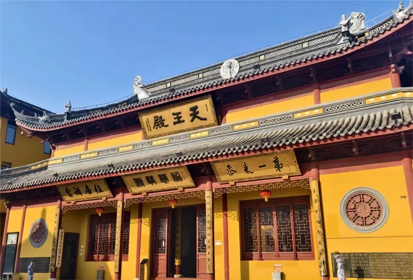 Heavenly Kings Hall at Shou'an Temple, Shanghai, with intricate carvings and statues