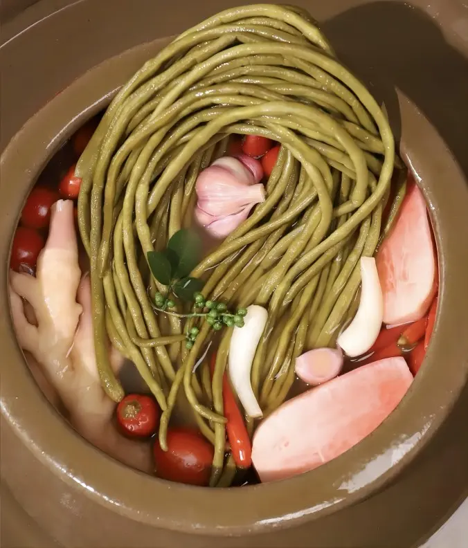 Close-up of Sichuan pickles fermenting in a traditional ceramic jar