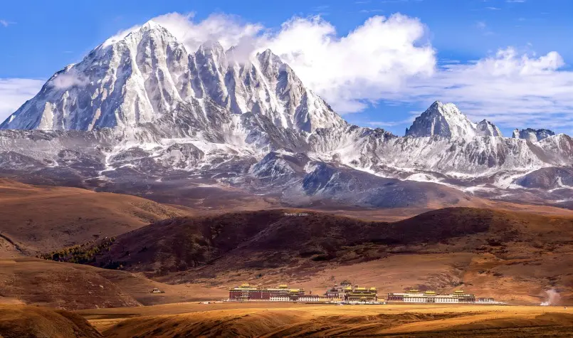 Winter panorama of Tagong Grassland with snow-covered mountains and open plateau