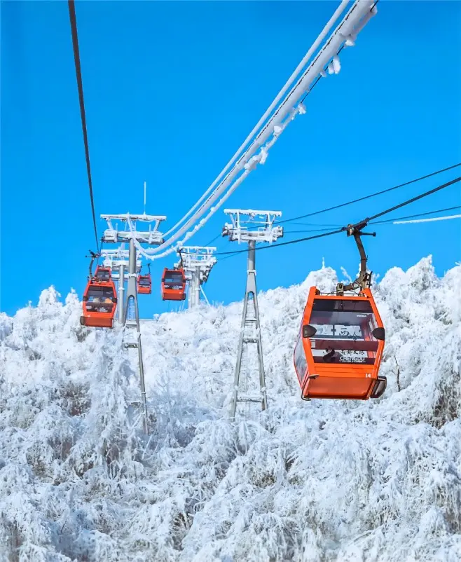 Cable car ride at Xiling Snow Mountain offering panoramic mountain views