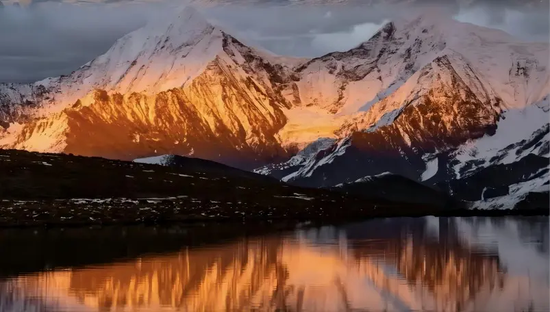 Fresh snow and golden peaks at YuZiXi after snowfall in western Sichuan