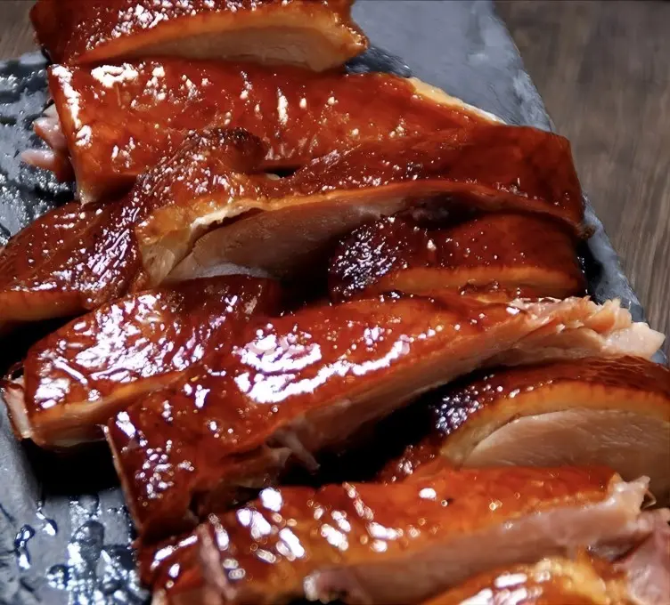 Close-up of crispy and tender Zhangcha Duck (Camphor Tea Duck), signature Sichuan dish in Chengdu