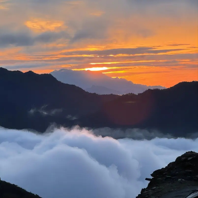 Sunrise above the sea of clouds at the Mount Zhaogong observation deck, a popular photography spot.