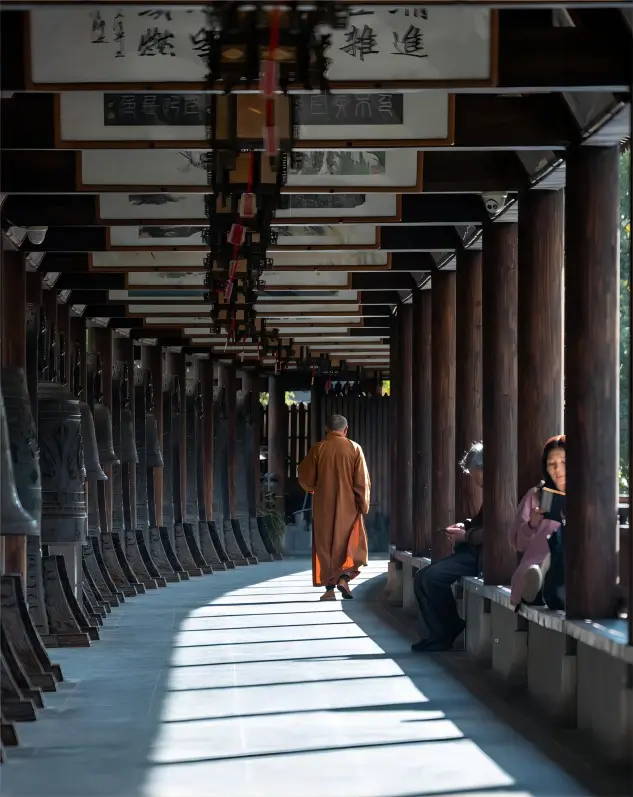 Monks and devotees turning prayer wheels at Zhenru Temple in Shanghai, capturing a living Zen atmosphere.