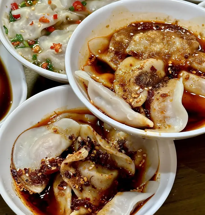 Bowl of Zhong dumplings in sweet and spicy sauce, Chengdu street food classic