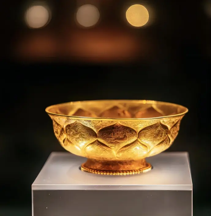 Gilded gold bowl with lotus patterns from the Tang Dynasty, displayed in the Shaanxi History Museum