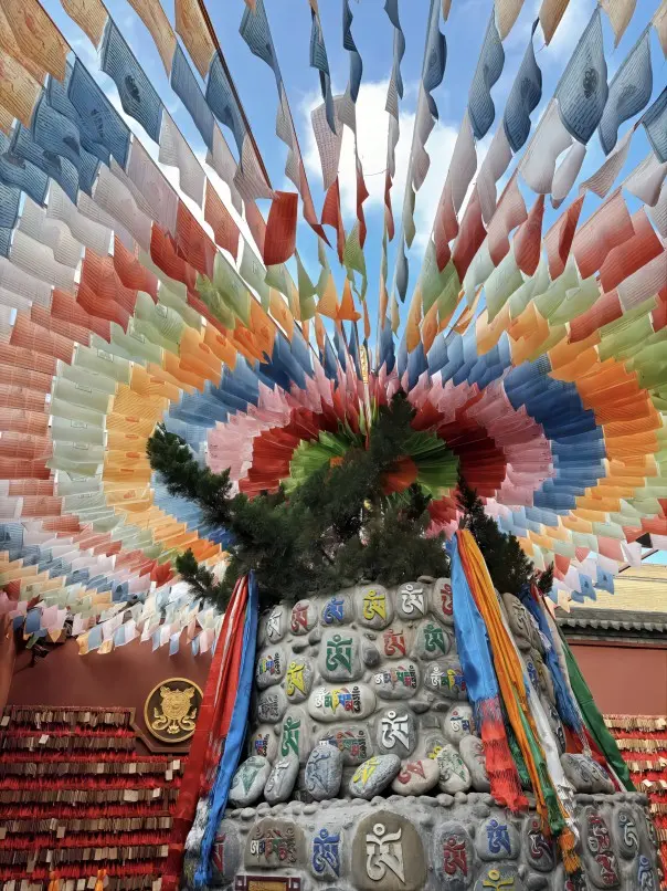 Colorful Tibetan prayer flags fluttering inside Guangren Temple in Xi’an