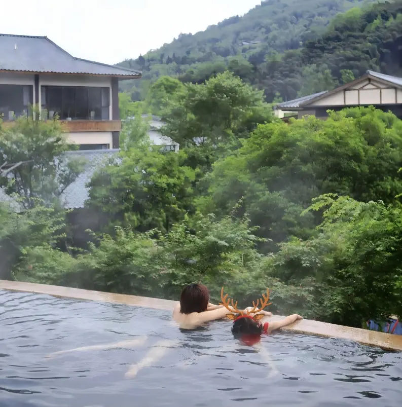 Soaking in a hot spring at Xiling Snow Mountain during a Chengdu winter 3-day itinerary